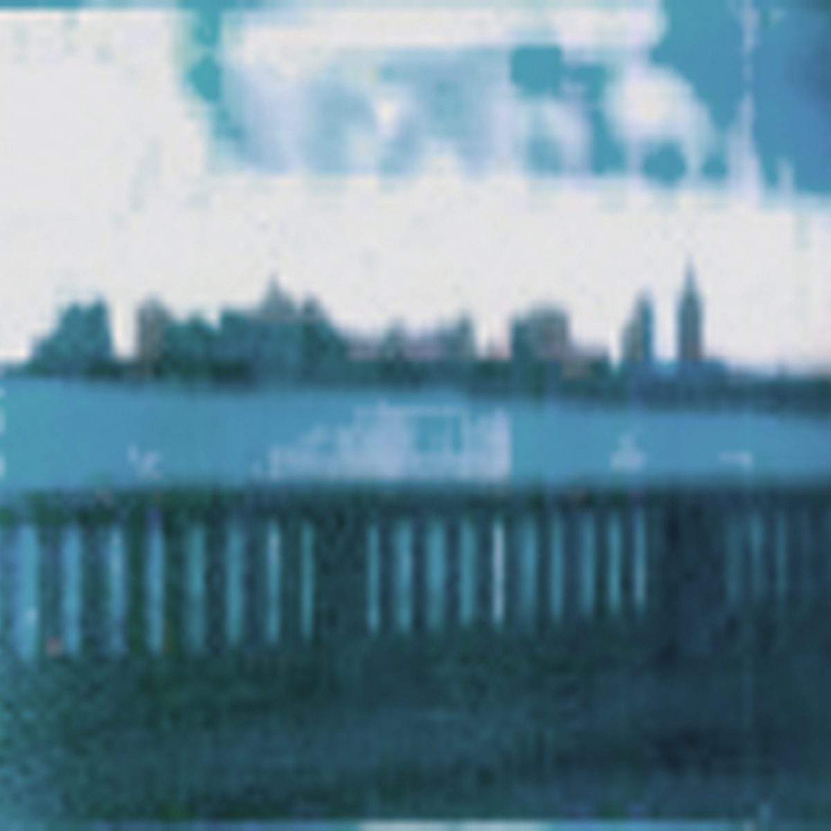 A blurred photograph showing buildings in a long distance