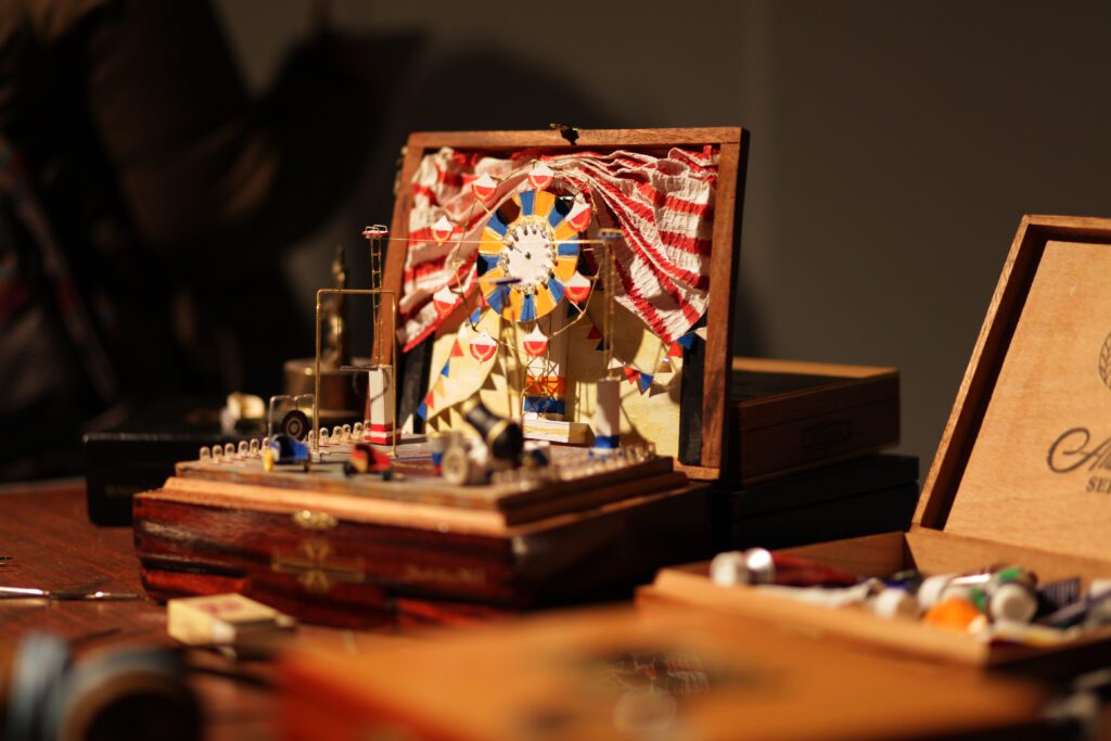 Old cigar box with miniature circus for art installation