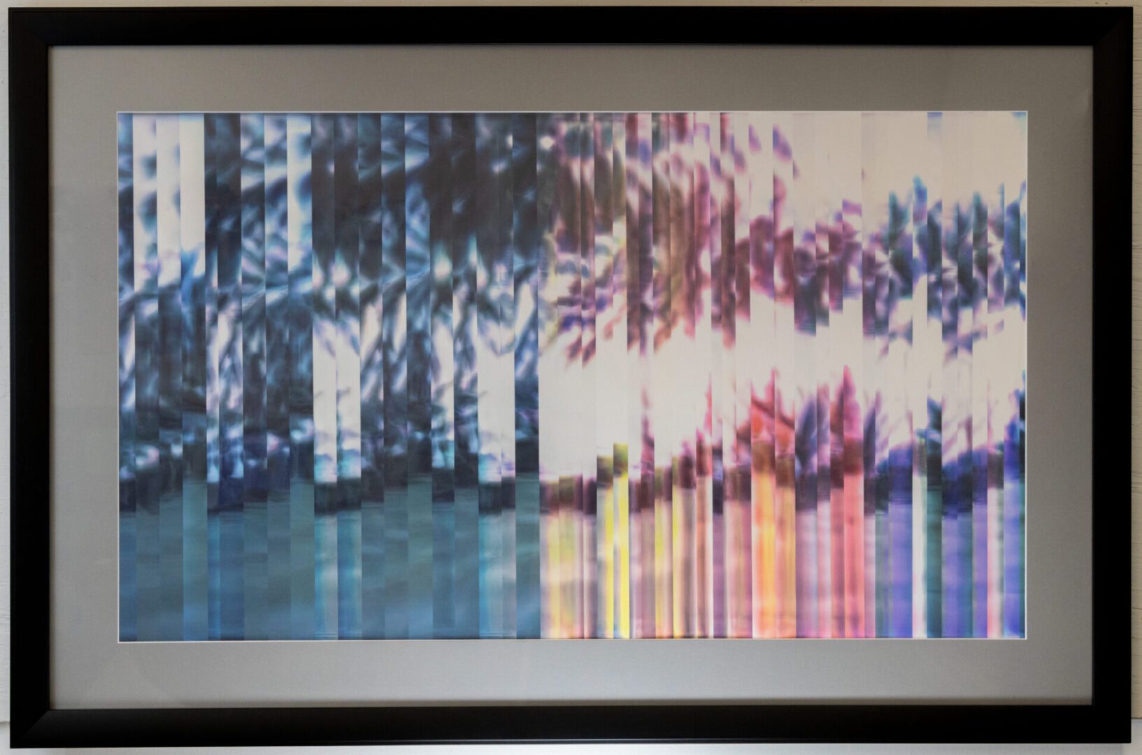 A framed image of a colorful pixelated image.