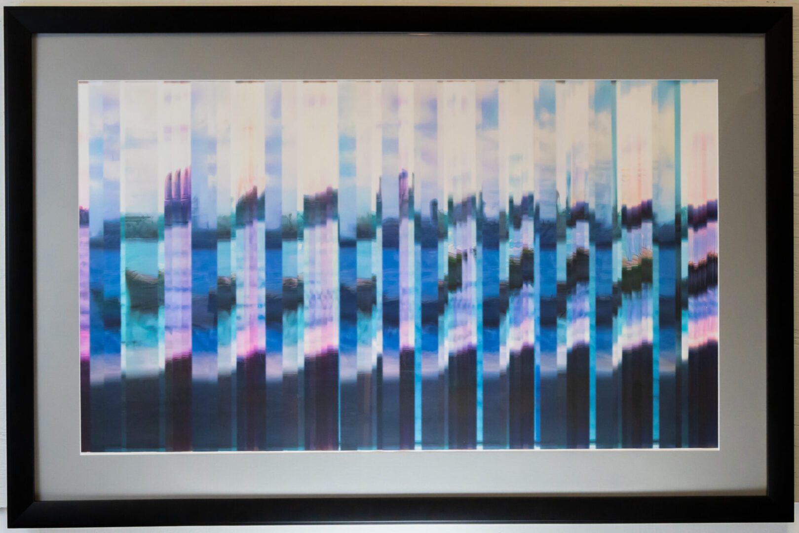 A framed print of a blue and purple striped pattern.