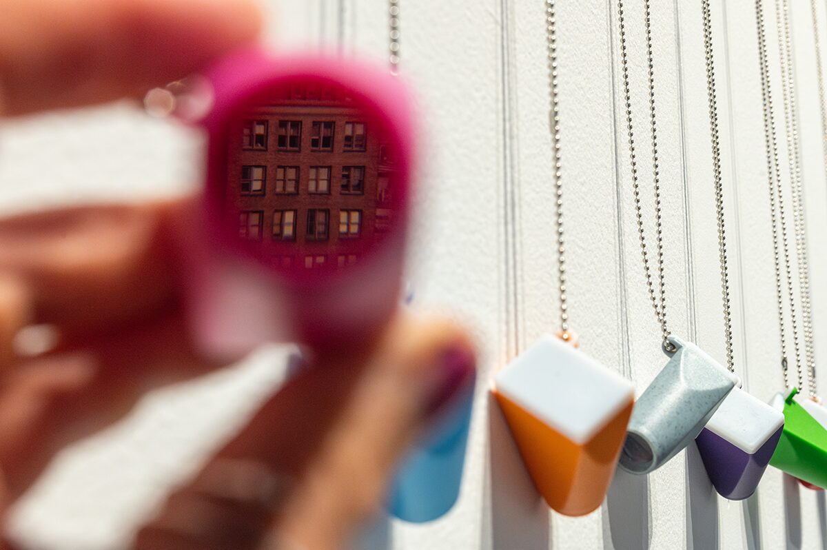 Building reflected in pink keychain.