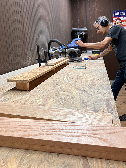 man in woodshop building a box